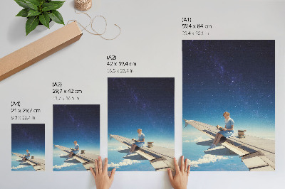 Foto su tela Libri dell'universo della ragazza sull'ala di un aereo