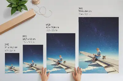 Foto su tela ragazza sull'ala di un aereo con elementi dell'universo