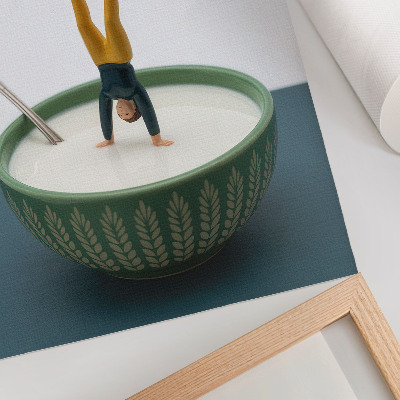 Poster Statuetta in una ciotola di latte con foglie verdi