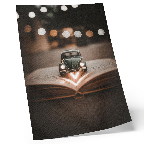 Poster Macchina in miniatura su un libro con luci magiche