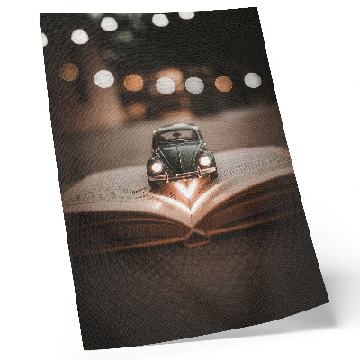 Poster Macchina in miniatura su un libro con luci magiche