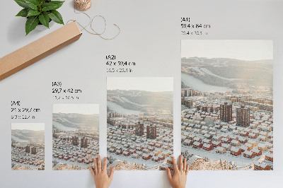 Poster Paesaggio invernale con case coperte di neve