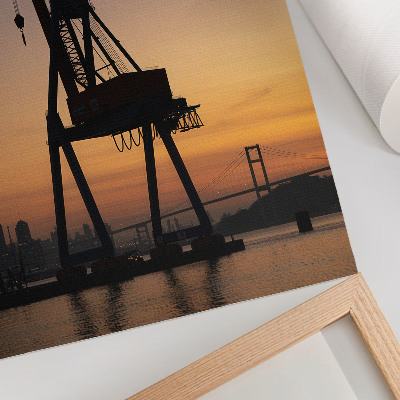 Poster silhouette di gru industriale tramonto ponte