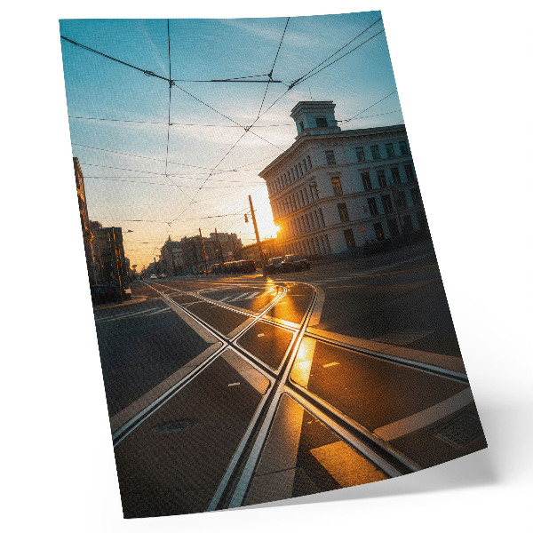 Foto su tela Il sole che tramonta sulla città con l'architettura