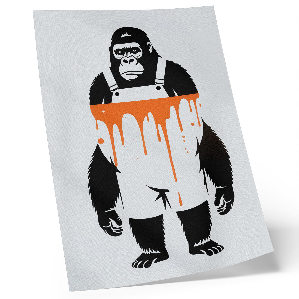 Stampa su tela Un gorilla in tuta da lavoro su uno sfondo arancione acceso.