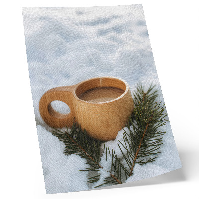 Foto su tela Tazza di legno, paesaggio innevato, ramoscelli verdi