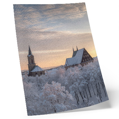 Foto su tela Paesaggio invernale con una chiesa innevata