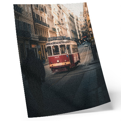 Poster Un tram tra gli edifici storici della città.