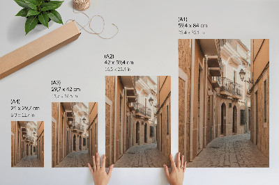 Foto su tela Via stretta, edifici in pietra, tonalità calde