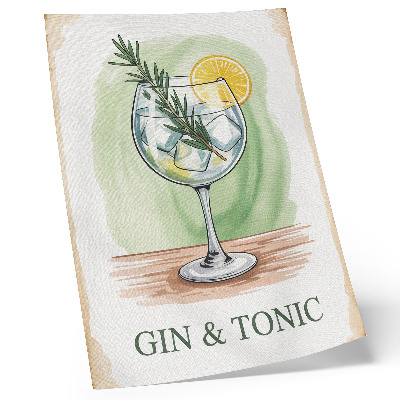 Foto su tela Un bicchiere di gin, rosmarino e limone su uno sfondo verde.