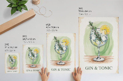 Foto su tela Un bicchiere di gin, rosmarino e limone su uno sfondo verde.