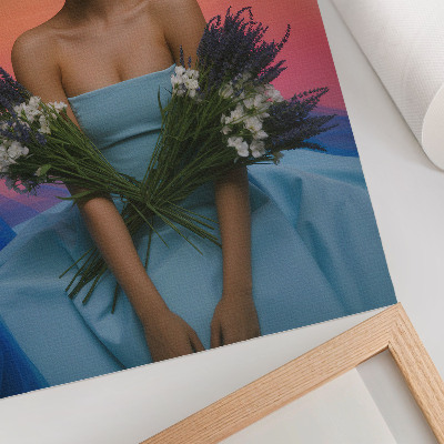 Stampa su tela Donna con fiori sullo sfondo di un tramonto
