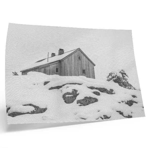 Poster murale di alta qualità Una casa invernale minimalista sullo sfondo della neve.