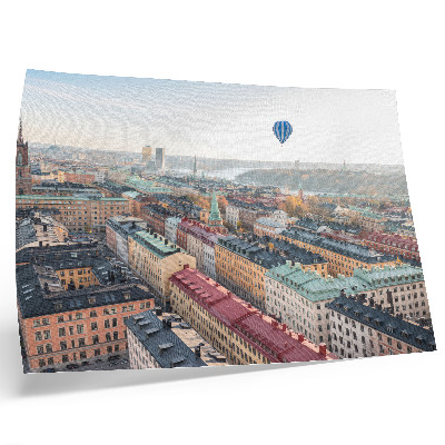 Poster Palloncino colorato sopra il cielo degli edifici di una città