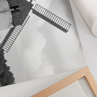 Poster dai colori saturi Un mulino a vento bianco e nero in un campo con dei cavalli