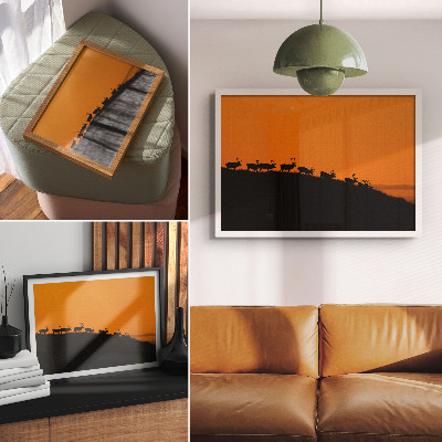 Poster Sagome di cervi su una collina con sfondo arancione