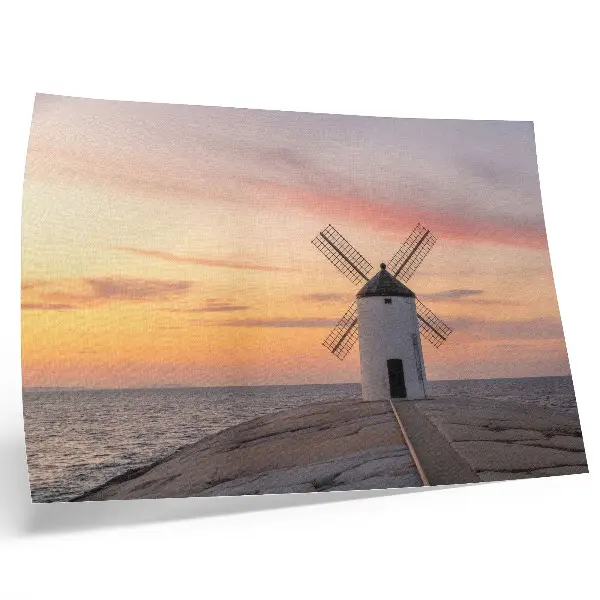 Stampa su tela moderna mulino a vento al tramonto con mare e cielo color pastello