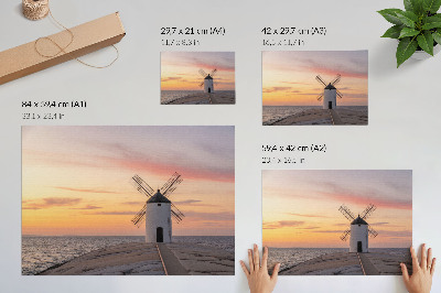 Stampa su tela moderna Mulino a vento alla luce del tramonto, mare, cielo color pastello