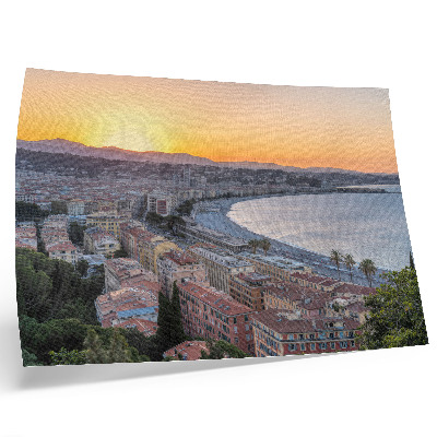 Poster dai colori saturi Veduta della città al tramonto sul mare