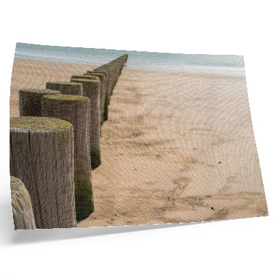 Poster dai colori saturi Paletti di legno spiaggia mare pace natura