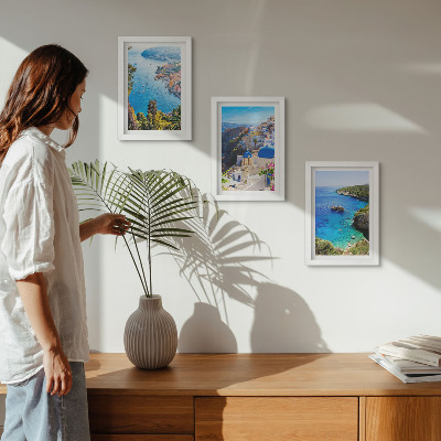 Composizione di 3 quadri Panorami costieri greci e la cittadina di Oia a Santorini.