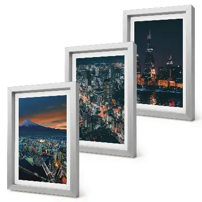 Trittico incorniciato vista notturna della città dalle montagne con grattacieli sullo sfondo