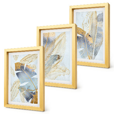 Composizione di 3 quadri Foglie nelle tonalità del blu e del beige su uno sfondo chiaro.