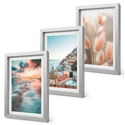 Composizione di 3 quadri con vista mare al tramonto, case colorate e fiori