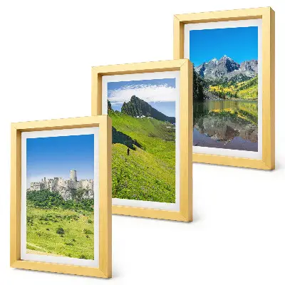 Trittico di quadri raffigurante verdi colline con un castello e paesaggi montani