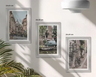 Composizione di 3 quadri con tranquille vedute cittadine di edifici