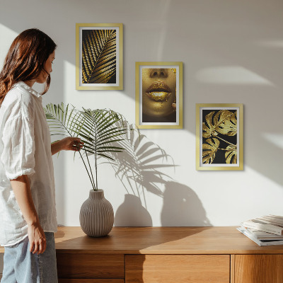 Composizione di 3 quadri foglie di palma volto di donna foglie di monstera