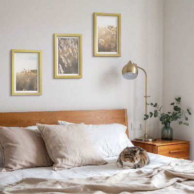 Composizione di 3 quadri Un paesaggio con erbe e fiori dalle tonalità calde