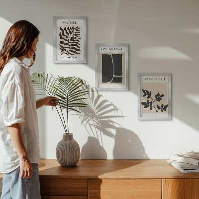 Composizione di 3 quadri Poster minimalisti con motivi vegetali e astratti.